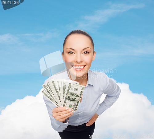 Image of smiling businesswoman with dollar cash money