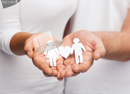 Image of couple hands with paper couple