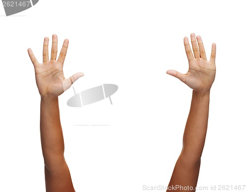 Image of two woman hands waving hands