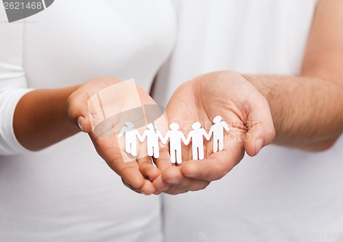 Image of couple hands with paper team