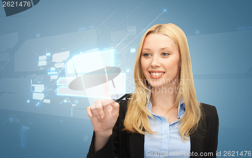 Image of businesswoman working with virtual screens