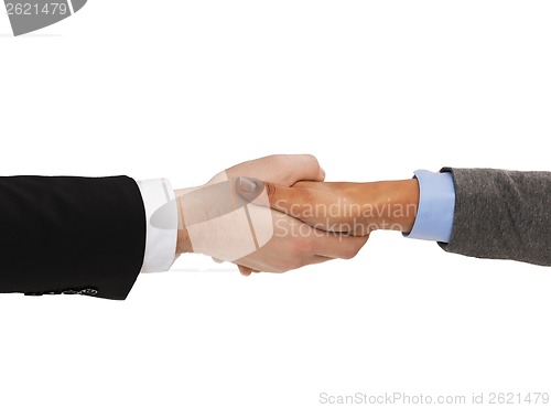 Image of businessman and businesswoman shaking hands