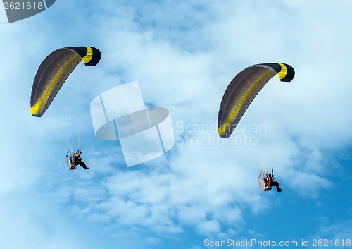 Image of Paragliding fly on blue sky