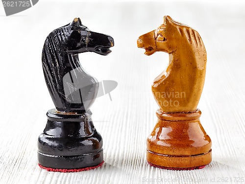 Image of Two old wooden chess pieces