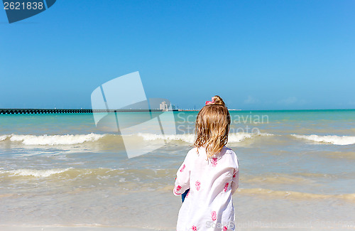 Image of Girl staring  at the ocean