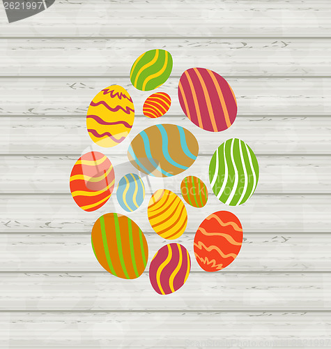 Image of Easter ornamental eggs on wooden background