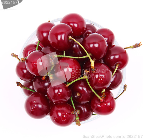 Image of Ripe fresh cherry in the glass isolated on white background