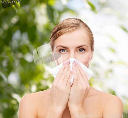 Image of beautiful woman with paper tissue