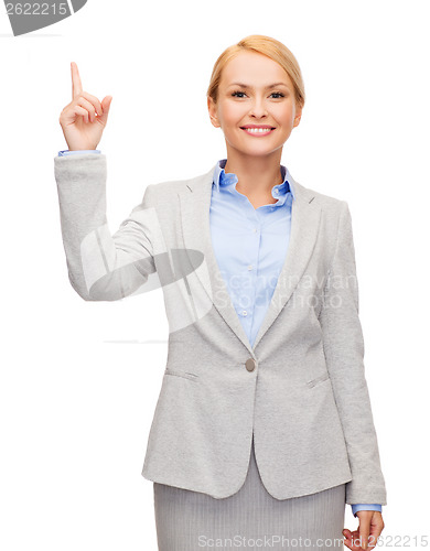 Image of smiling businesswoman with her finger up