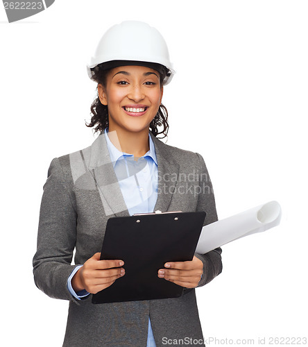 Image of businesswoman in white helmet with clipboard