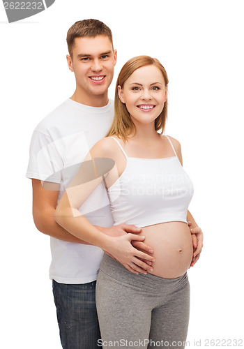 Image of happy young family expecting child