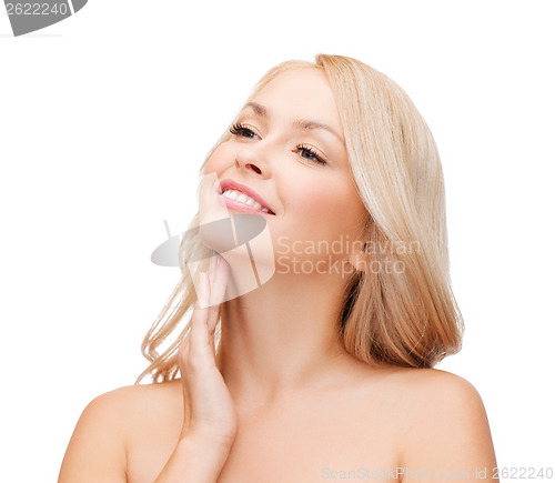 Image of woman touching her neck