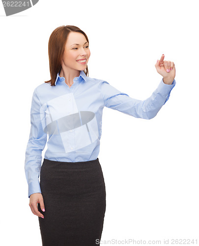 Image of smiling businesswoman working with virtual screen