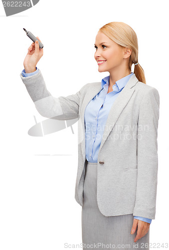 Image of businesswoman writing something in air with marker