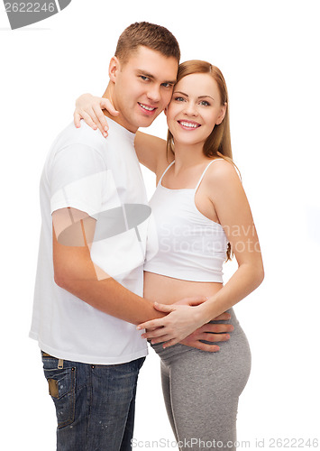 Image of happy young family expecting child