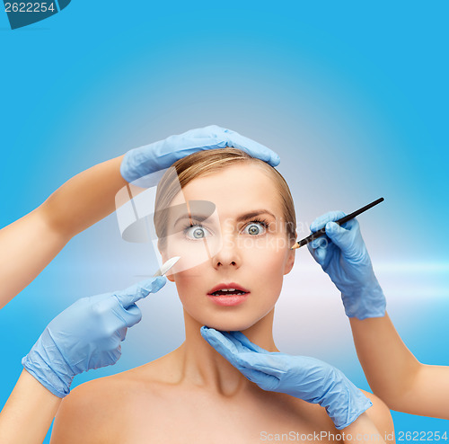 Image of woman face and beautician hands with pencil