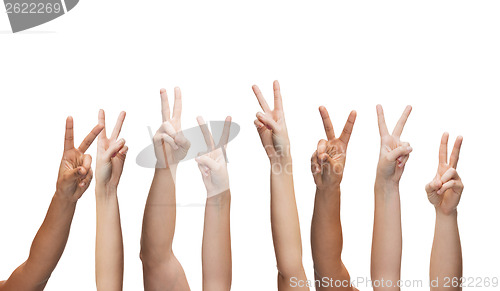Image of human hands showing v-sign