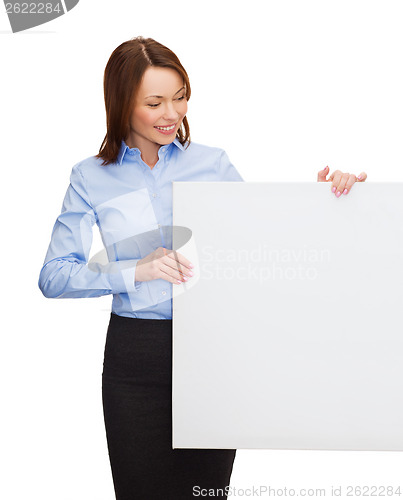 Image of smiling businesswoman with white blank board