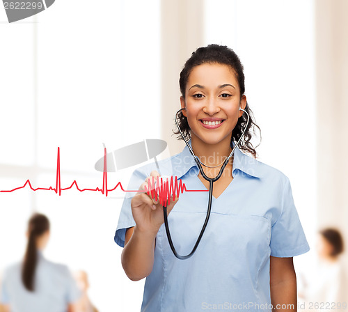 Image of smiling female african american doctor or nurse