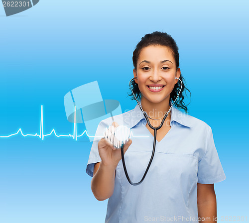 Image of smiling female african american doctor or nurse