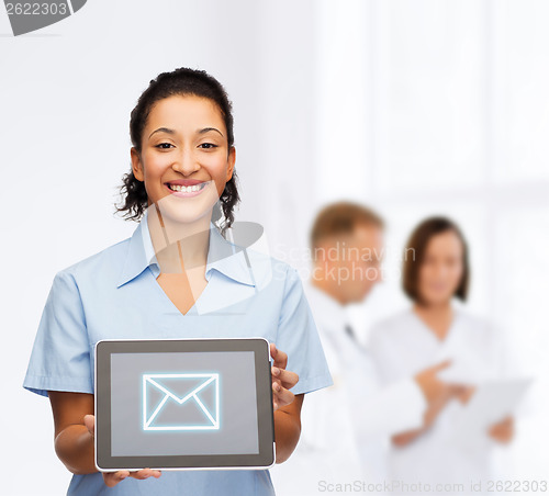 Image of smiling female doctor or nurse with tablet pc