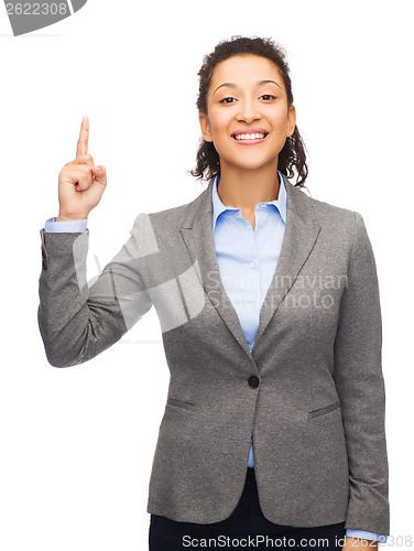 Image of smiling businesswoman with her finger up