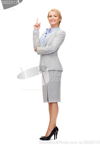 Image of smiling businesswoman with her finger up