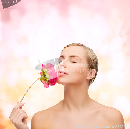 Image of lovely woman with peonie flower