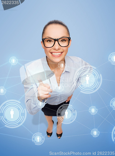 Image of smiling businesswoman with finger up