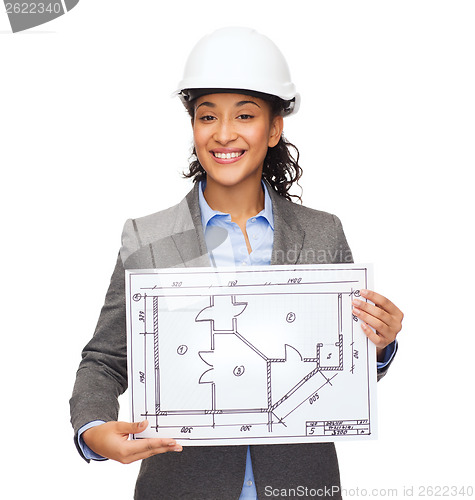 Image of businesswoman in white helmet with blueprint