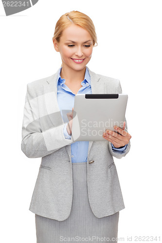 Image of smiling woman looking at tablet pc