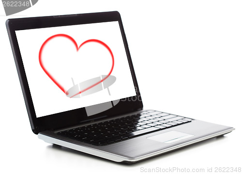 Image of laptop computer with heart on white screen