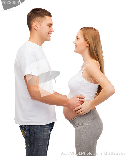 Image of happy young family expecting child