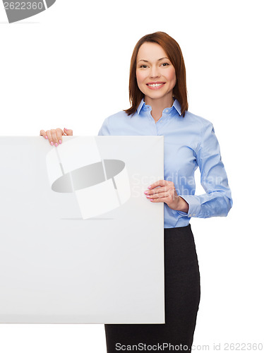 Image of smiling businesswoman with white blank board