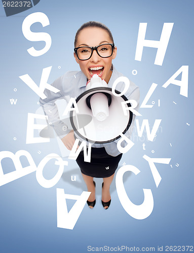 Image of screaming businesswoman with megaphone