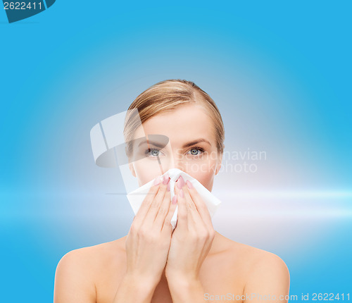 Image of beautiful woman with paper tissue