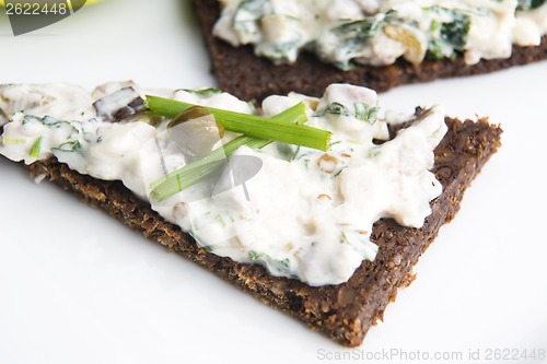 Image of sandwiches with dark bread, herrings, mushrooms, pepper