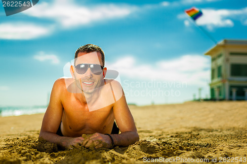 Image of sexy young man at the beach