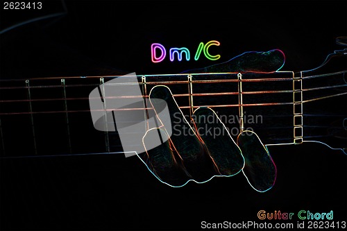 Image of Guitar chord on a dark background