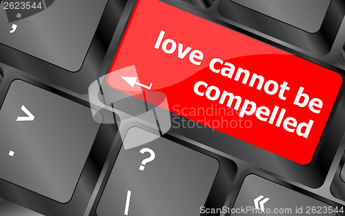 Image of love cannot be compelled words showing romance and love on keyboard keys