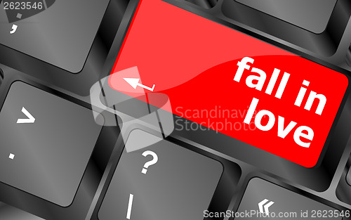 Image of Modern keyboard key with words fall in love