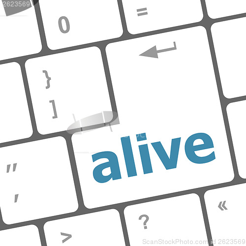 Image of alive text on laptop computer keyboard key button