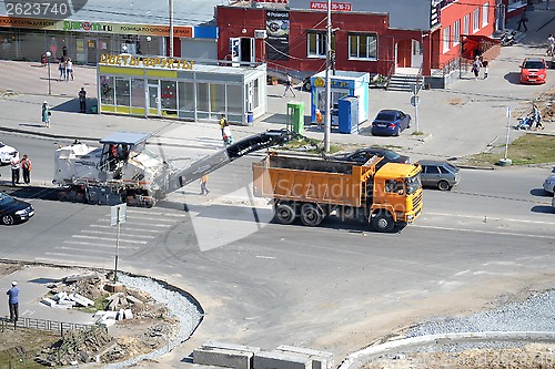 Image of Roadwork. Removal of old asphalt by means of special equipment.