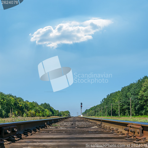 Image of one cloud over railroad to horizon