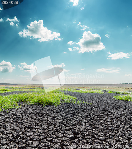 Image of dramatic blue sky with clouds over desert