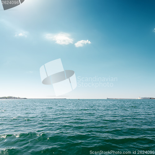 Image of blue sea and sky with clouds