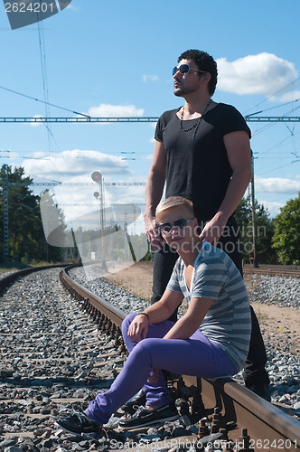 Image of Two young men on train tracks
