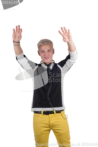Image of Man with headphones raising his hands up