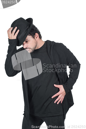 Image of Man in black dancing with his hat