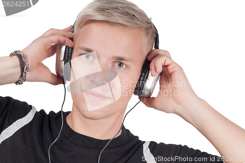Image of Young blond man in headphones watching on you